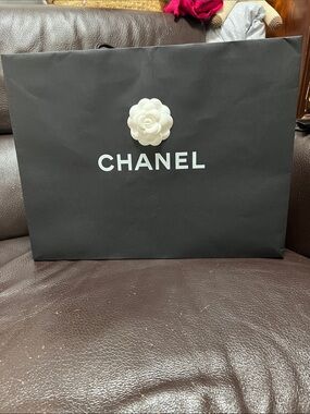 CHANEL Black Paper Shopping Bag with White Camellia Accent